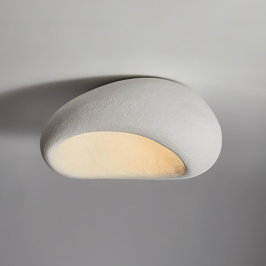 A wider view of this Clérachic ceiling light in its light speckled finish, glowing against plain grey.