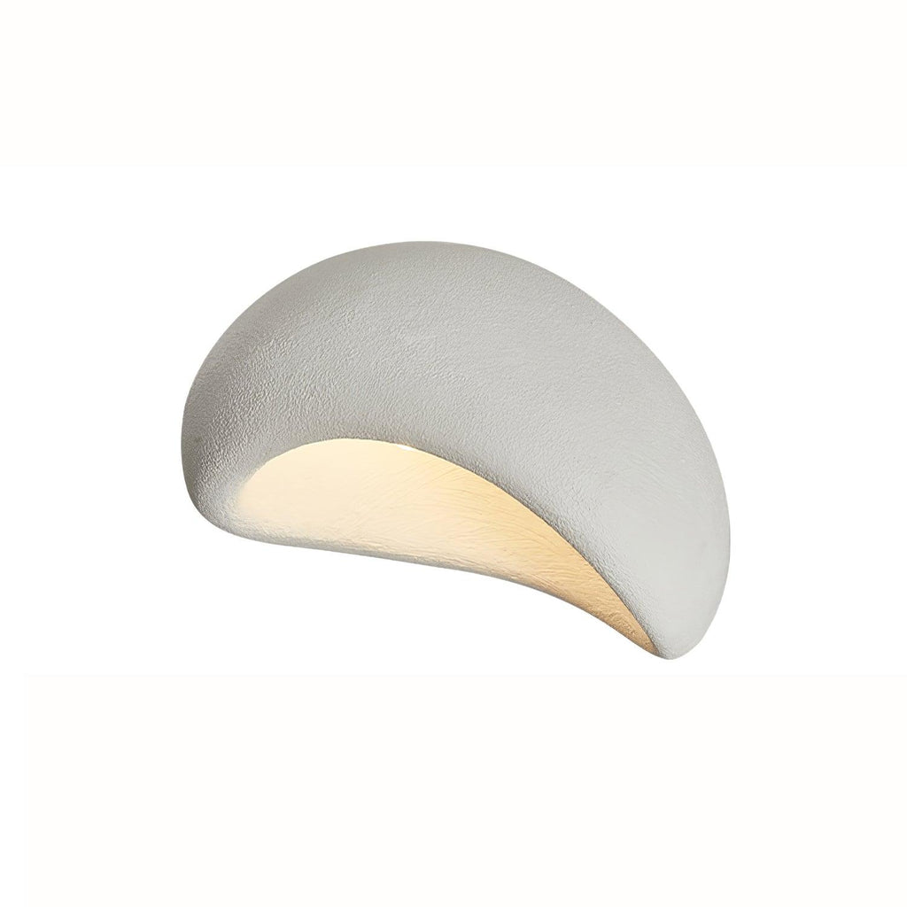 Angled against a plain white studio background, this Clérachic ceiling light glows in white texture.