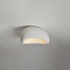 A smaller size of this Clérachic ceiling light glows in white texture against a plain grey background.