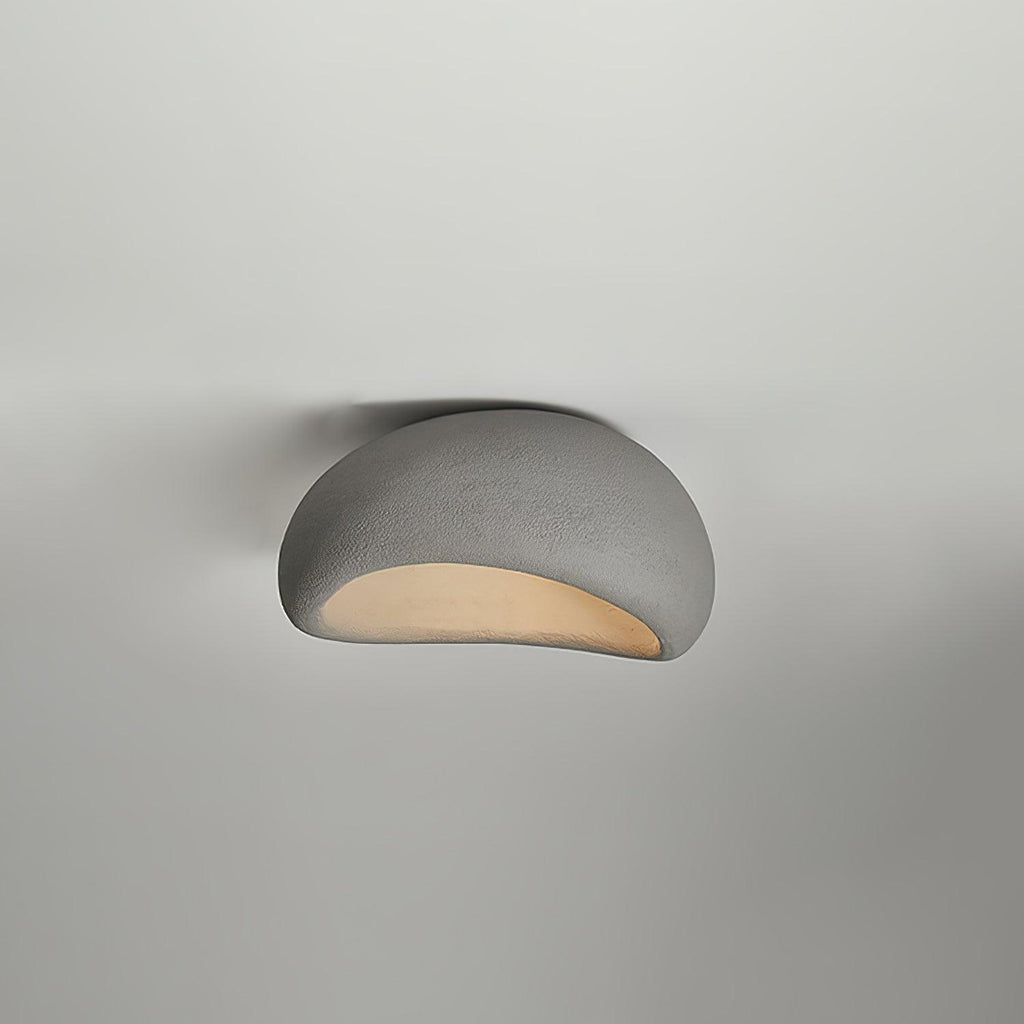 Against a softly graded grey backdrop, this Clérachic ceiling light glows in cement grey.