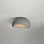 Against a softly graded grey backdrop, this Clérachic ceiling light glows in cement grey.