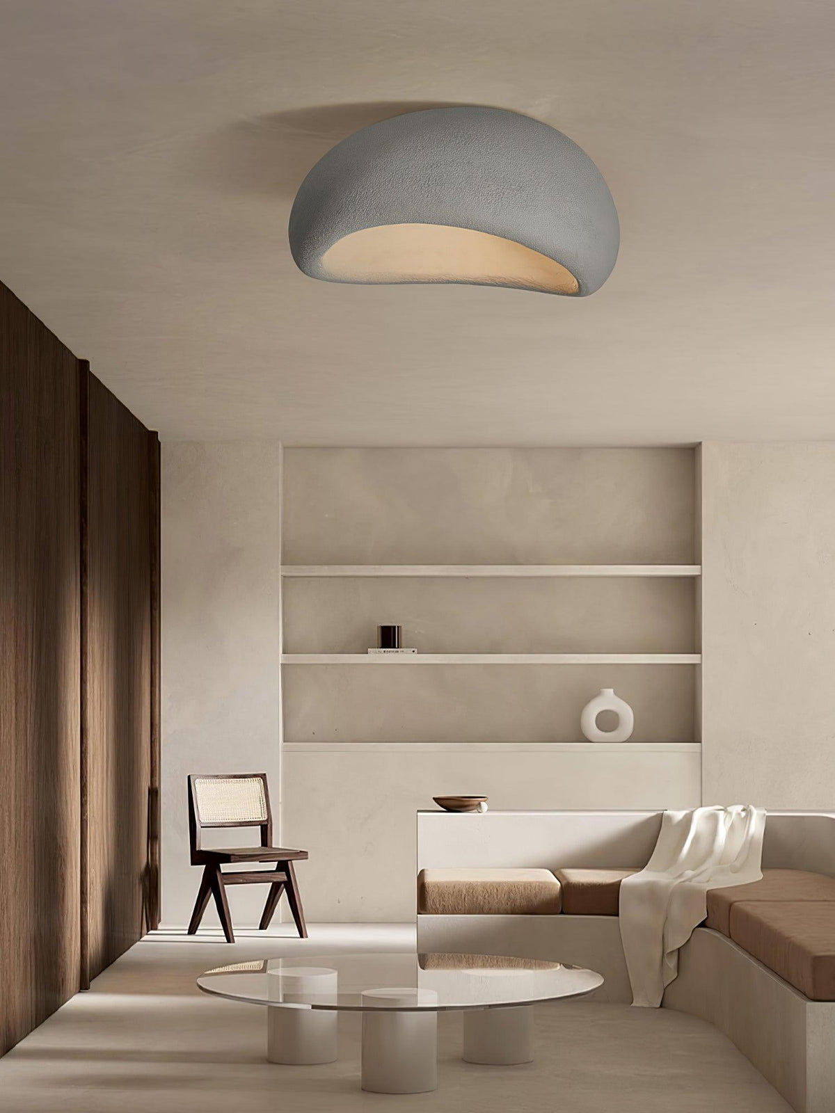 Above the same shelved alcove, this Clérachic ceiling light glows in its white texture finish.