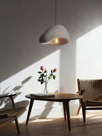 Selene Halia pendant light grey dome glowing gently overhead