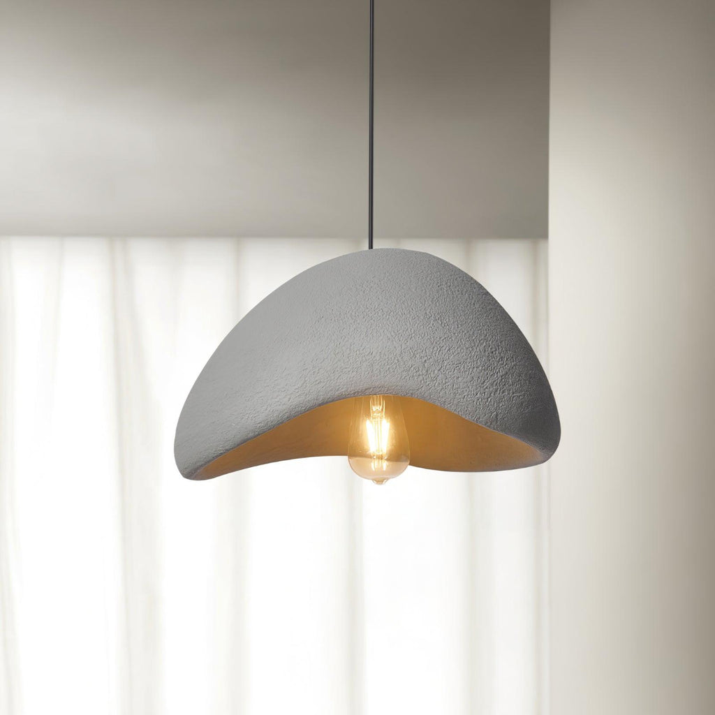 Selene Halia pendant light glowing gently above a calm interior
