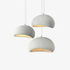 Wabi-sabi organic chandelier seen against a pale ceiling