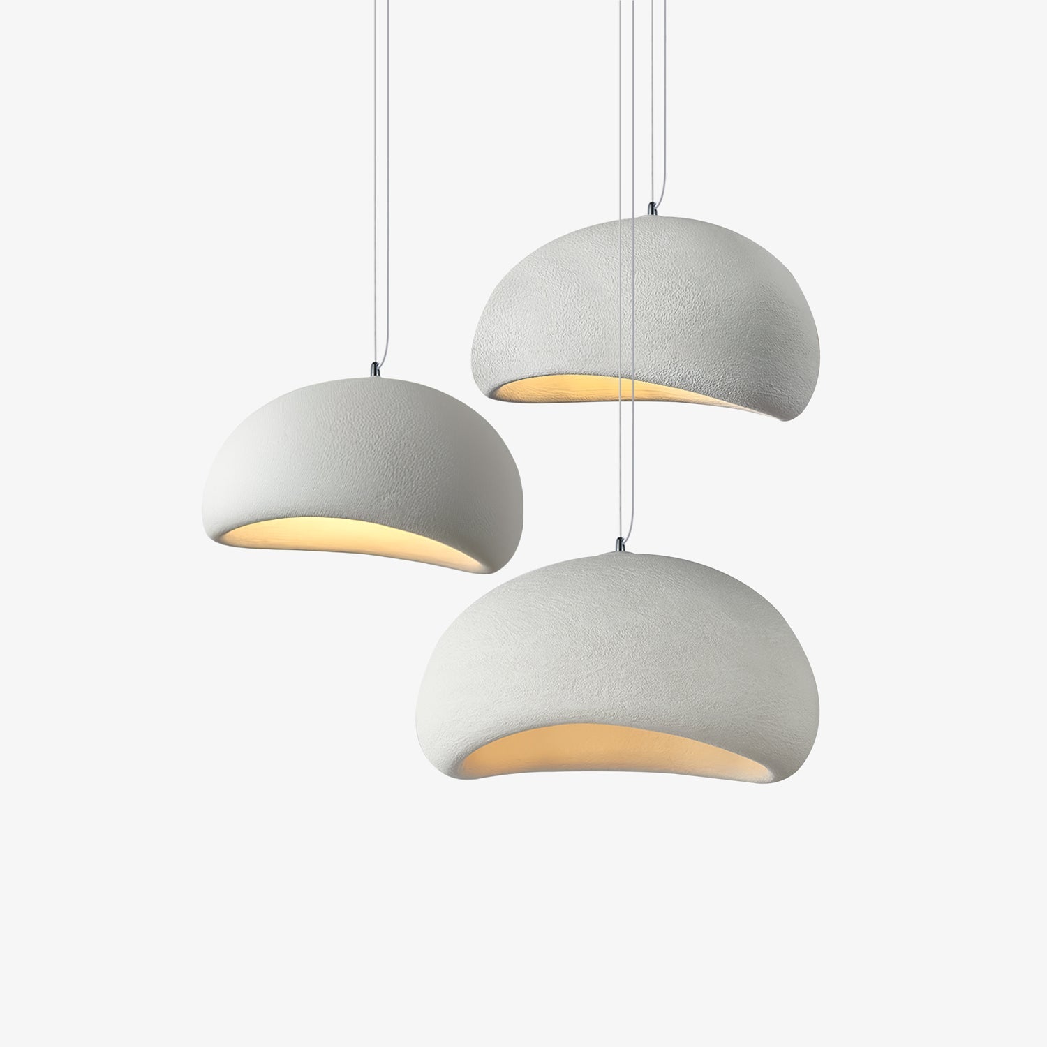Wabi-sabi organic chandelier seen against a pale ceiling
