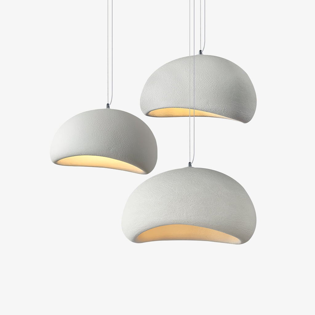 Wabi-sabi organic chandelier seen against a pale ceiling