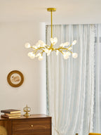 Glass leaf sputnik chandelier casting warm ambient light
