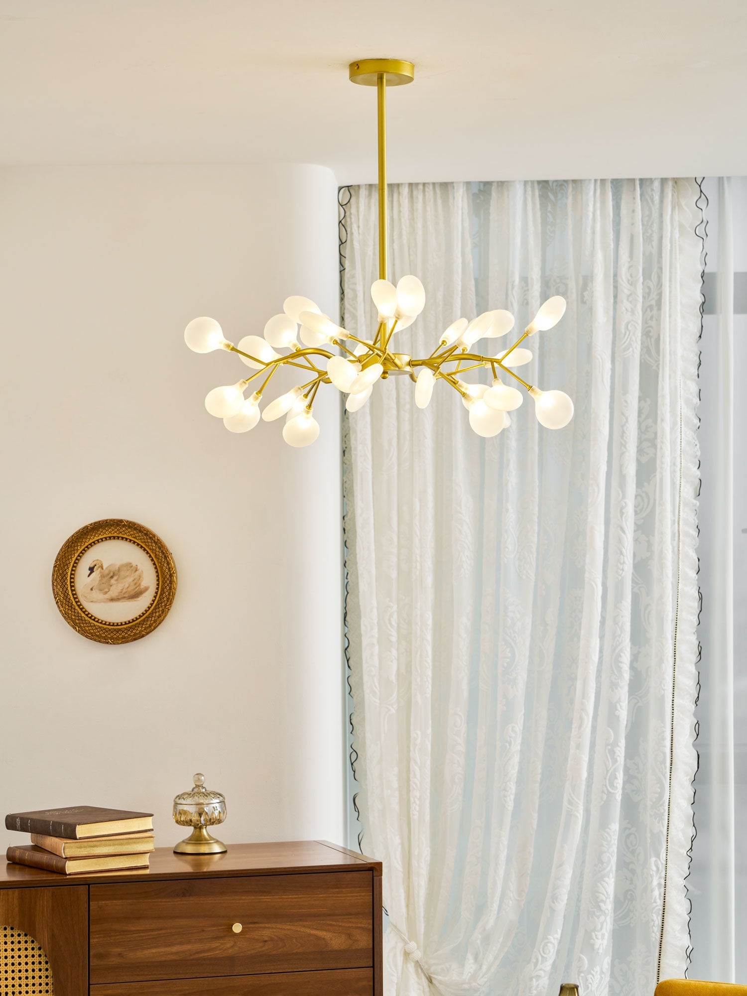 Glass leaf sputnik chandelier casting warm ambient light