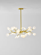 Sputnik chandelier with many glass leaves glowing softly