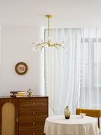 Gold sputnik chandelier with translucent glass leaf arms