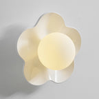 Close studio shot of this Clérachic wall light in white with its ball lit, against a plain grey backdrop.