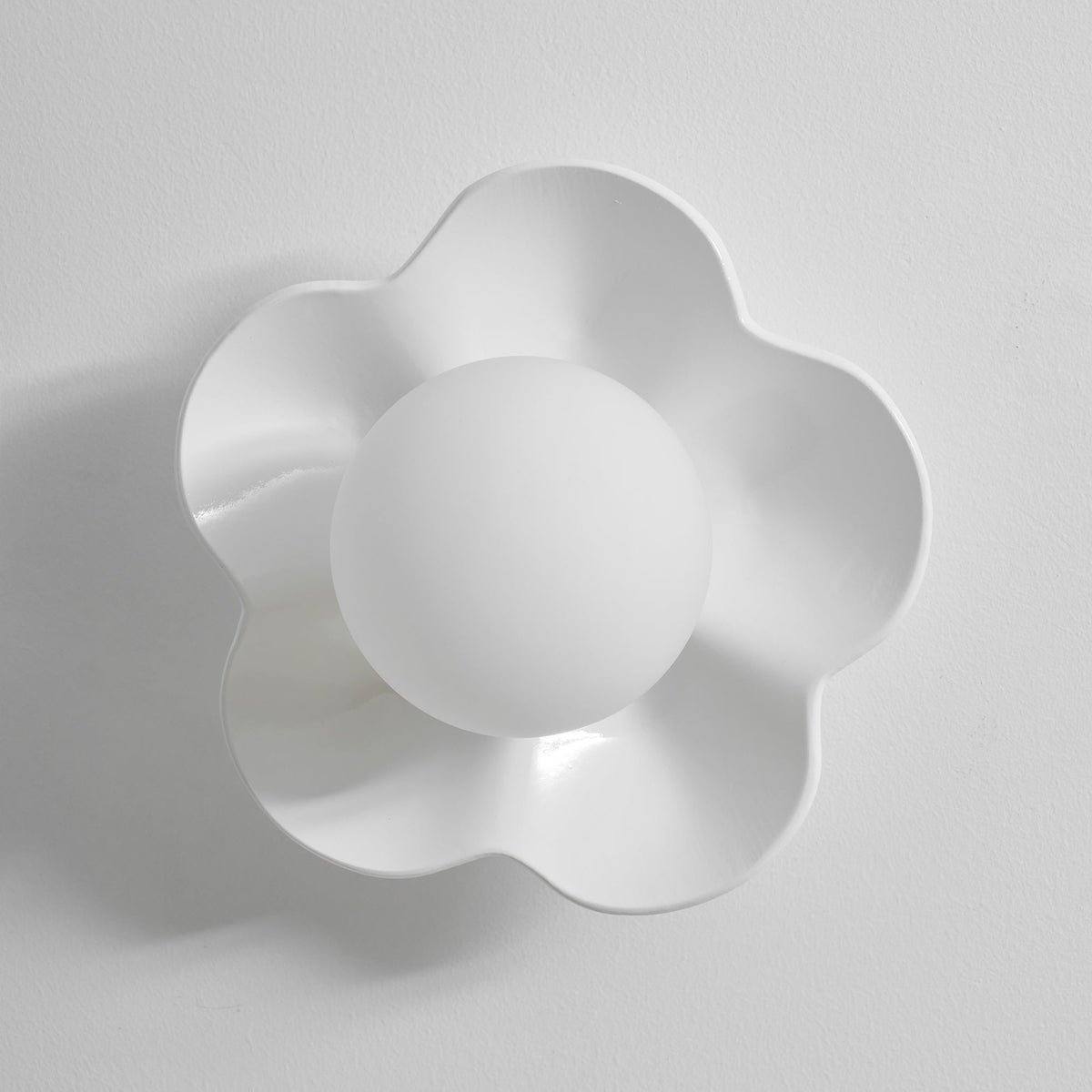 Close studio shot of this Clérachic wall light in white, unlit against a plain white backdrop.