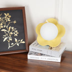 A second angle of this Clérachic wall light in yellow beside the same framed print.
