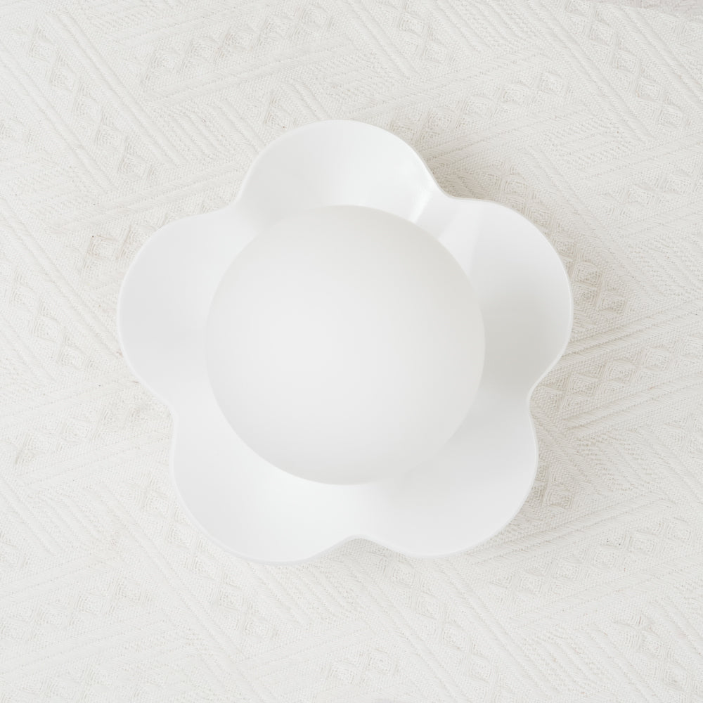 Photographed straight on, this Clérachic wall light in white sits unlit against a textured pale backdrop.