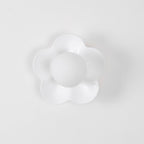 Against a plain backdrop, this Clérachic wall light in white blends softly into the pale surface.