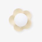 Seen straight on, this Clérachic wall light in a pale cream finish sits unlit against a white backdrop.