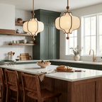 White fabric lantern pendant light shown against a plain wall
