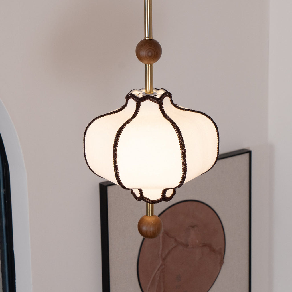 Fabric lantern pendant light shown with its adjustable canopy
