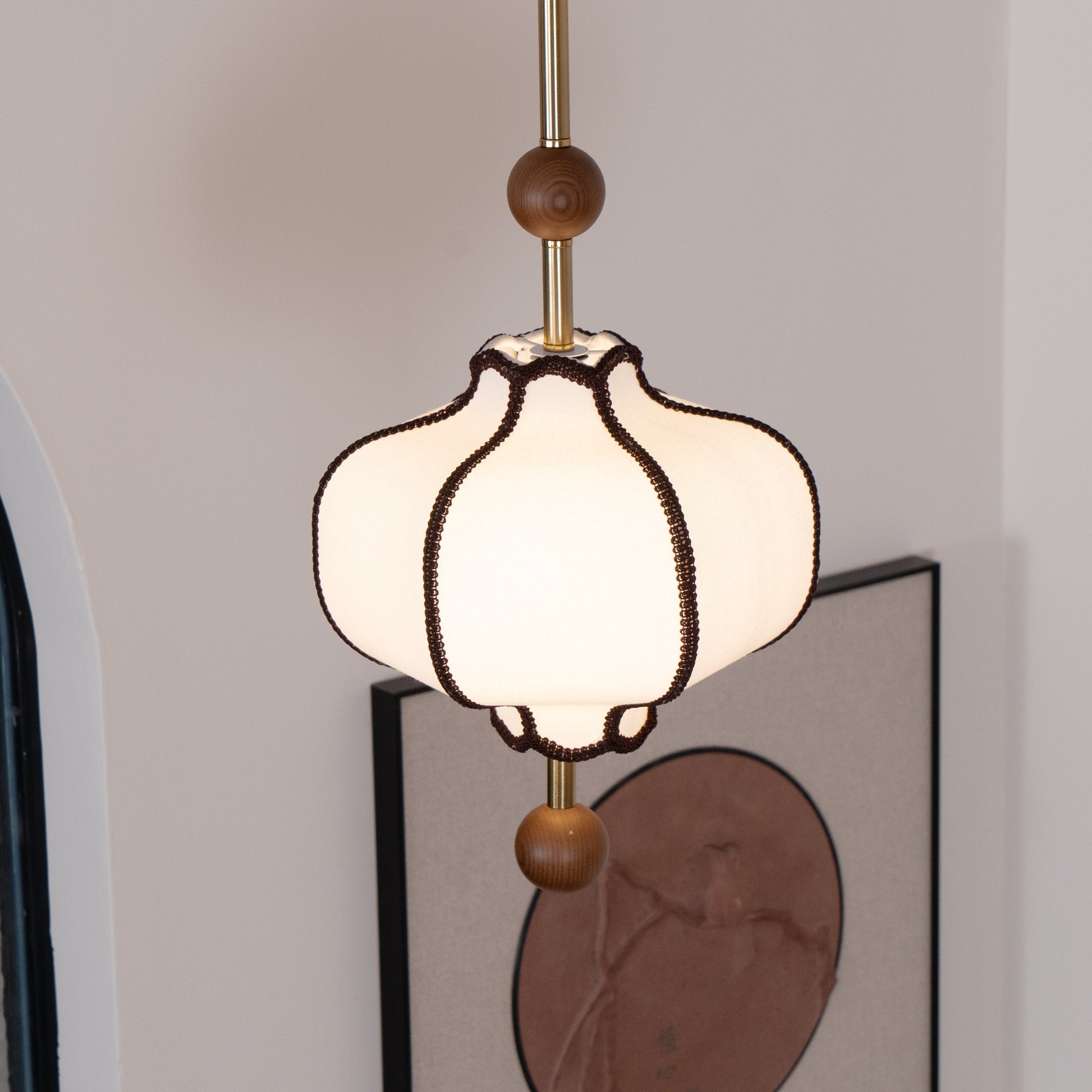 Fabric lantern pendant light shown with its adjustable canopy