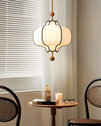 White fabric lantern pendant light with warm ambient glow