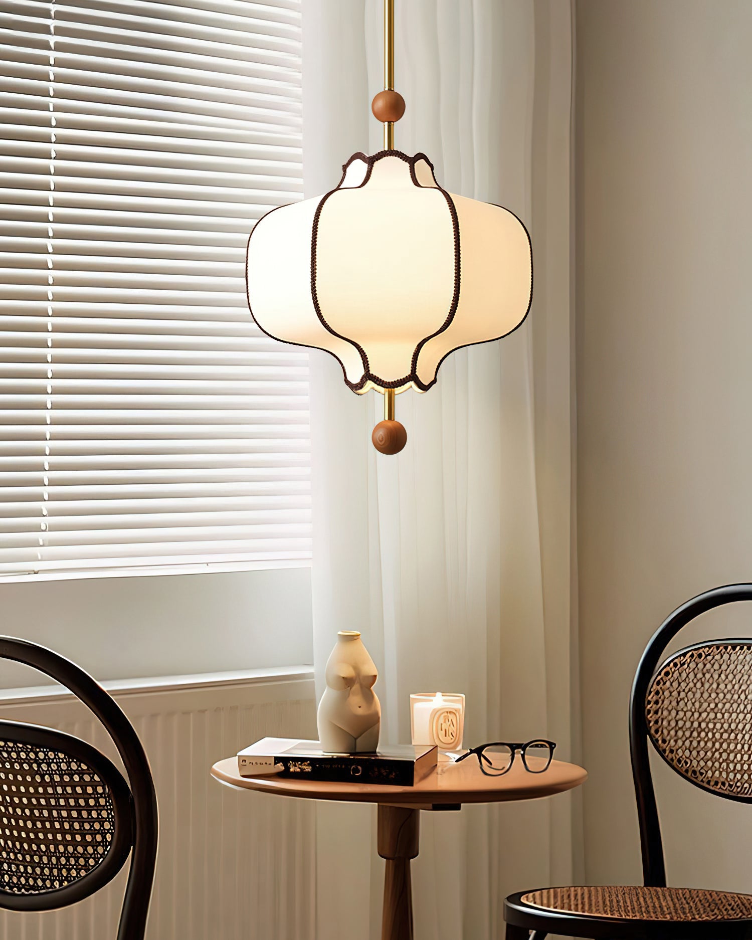 White fabric lantern pendant light with warm ambient glow