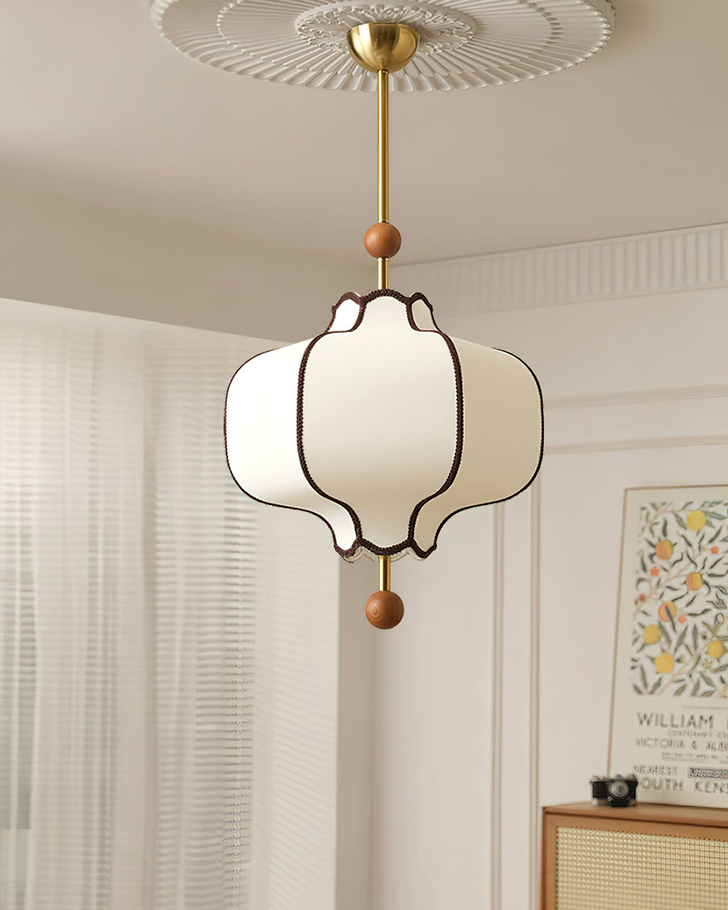 White lantern pendant light hanging at adjustable rod height