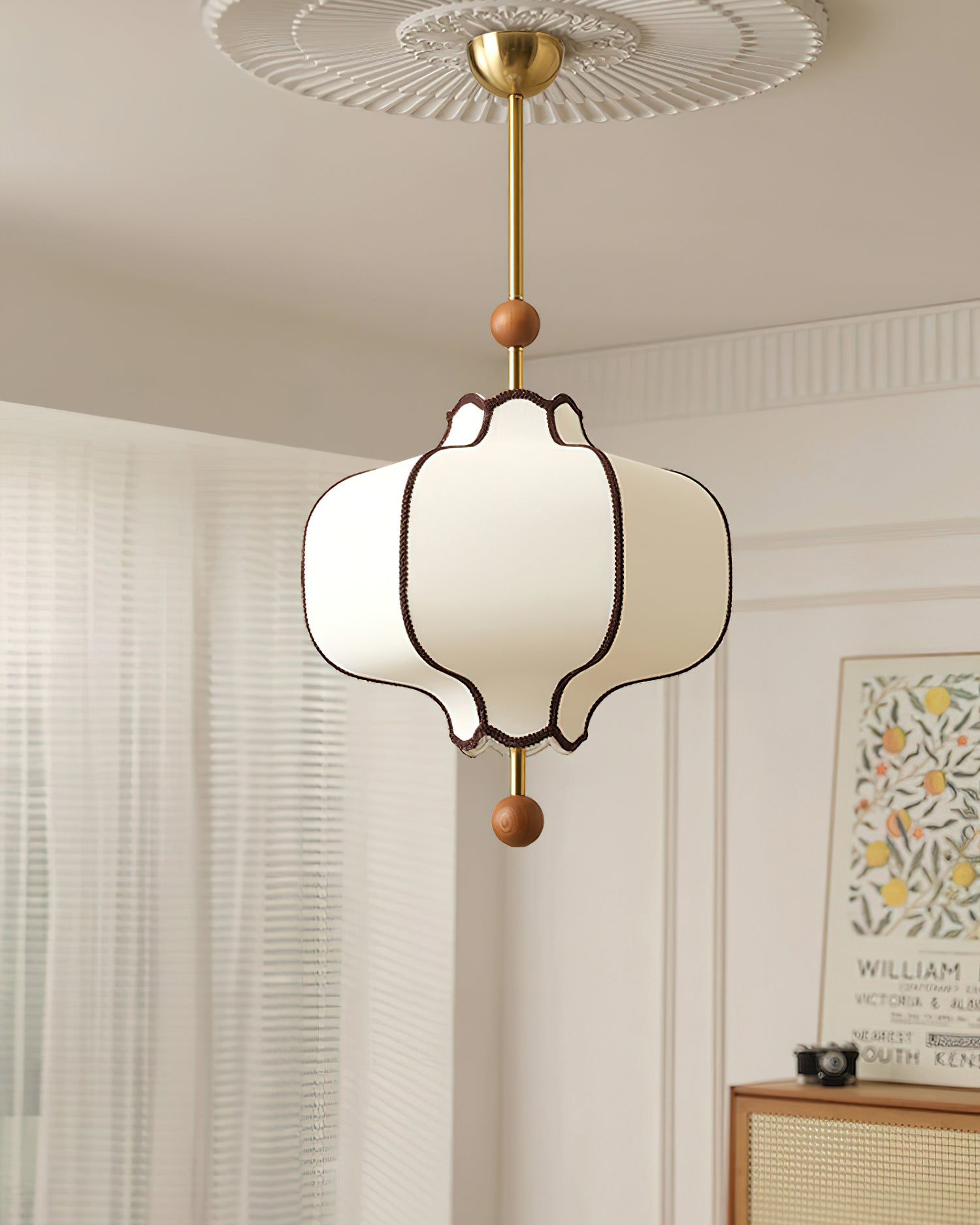 White lantern pendant light hanging at adjustable rod height