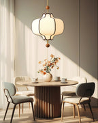 Lantern pendant light with white shade in a warm room setting