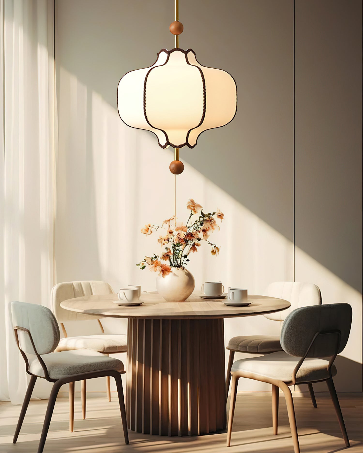 Lantern pendant light with white shade in a warm room setting