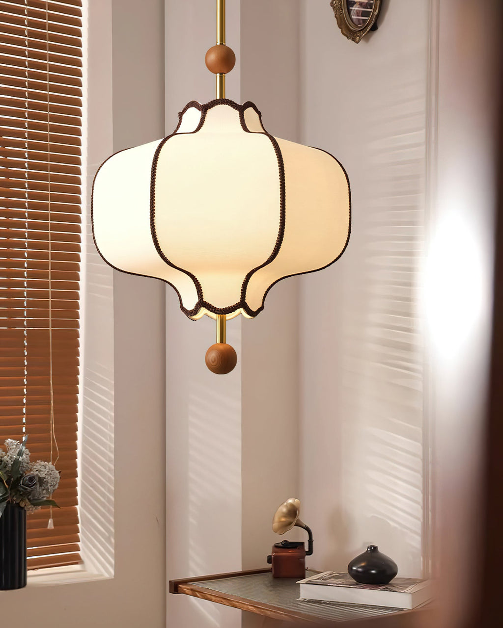 White fabric lantern pendant light hanging in a calm interior