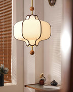 White fabric lantern pendant light hanging in a calm interior