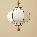 Fabric pendant light with warm filament bulb glowing softly