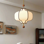 Fabric pendant light with warm Edison-style bulb detail