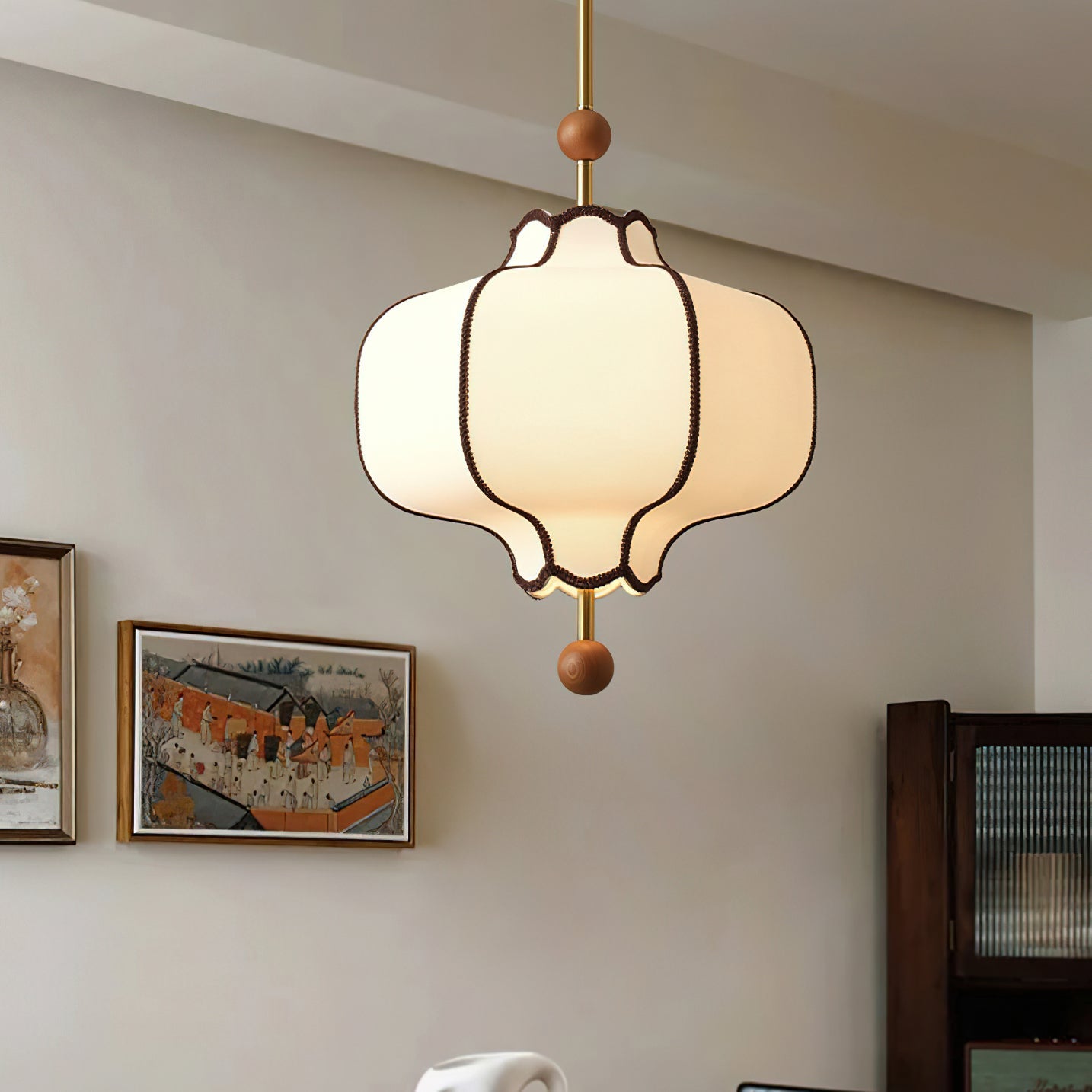 Fabric pendant light with warm Edison-style bulb detail
