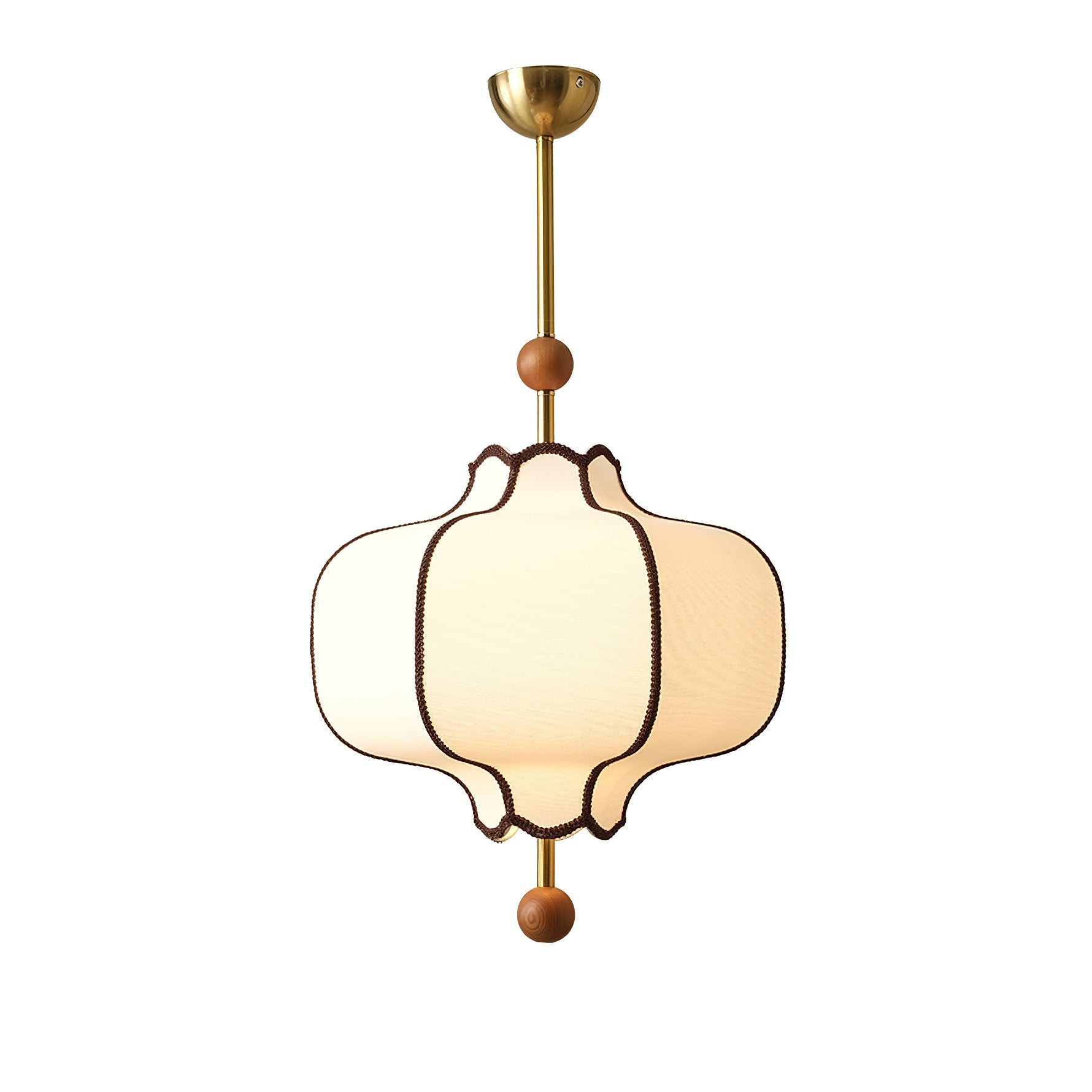 White fabric lantern pendant light hanging over a dining table