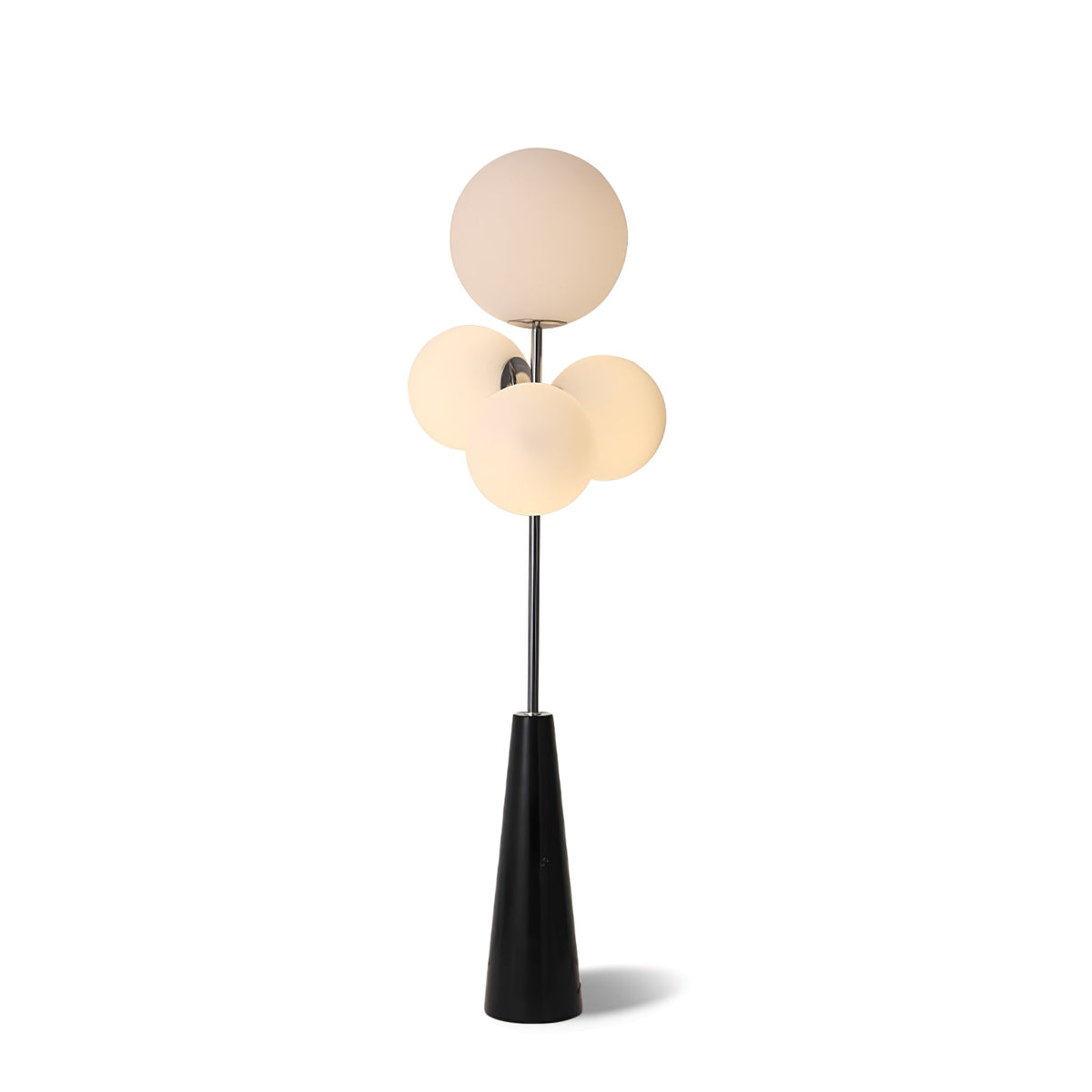 Clérachic floor lamp lit against a plain white backdrop, its frosted white glass globes shown alone with no lifestyle props in frame.