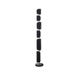 The Clérachic floor lamp shown alone on a plain white background, its black glass panels and gold pole unlit.