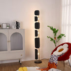 The same Clérachic corner setting shown from a wider angle, the black glass panels lit beside the cream arched cabinet.