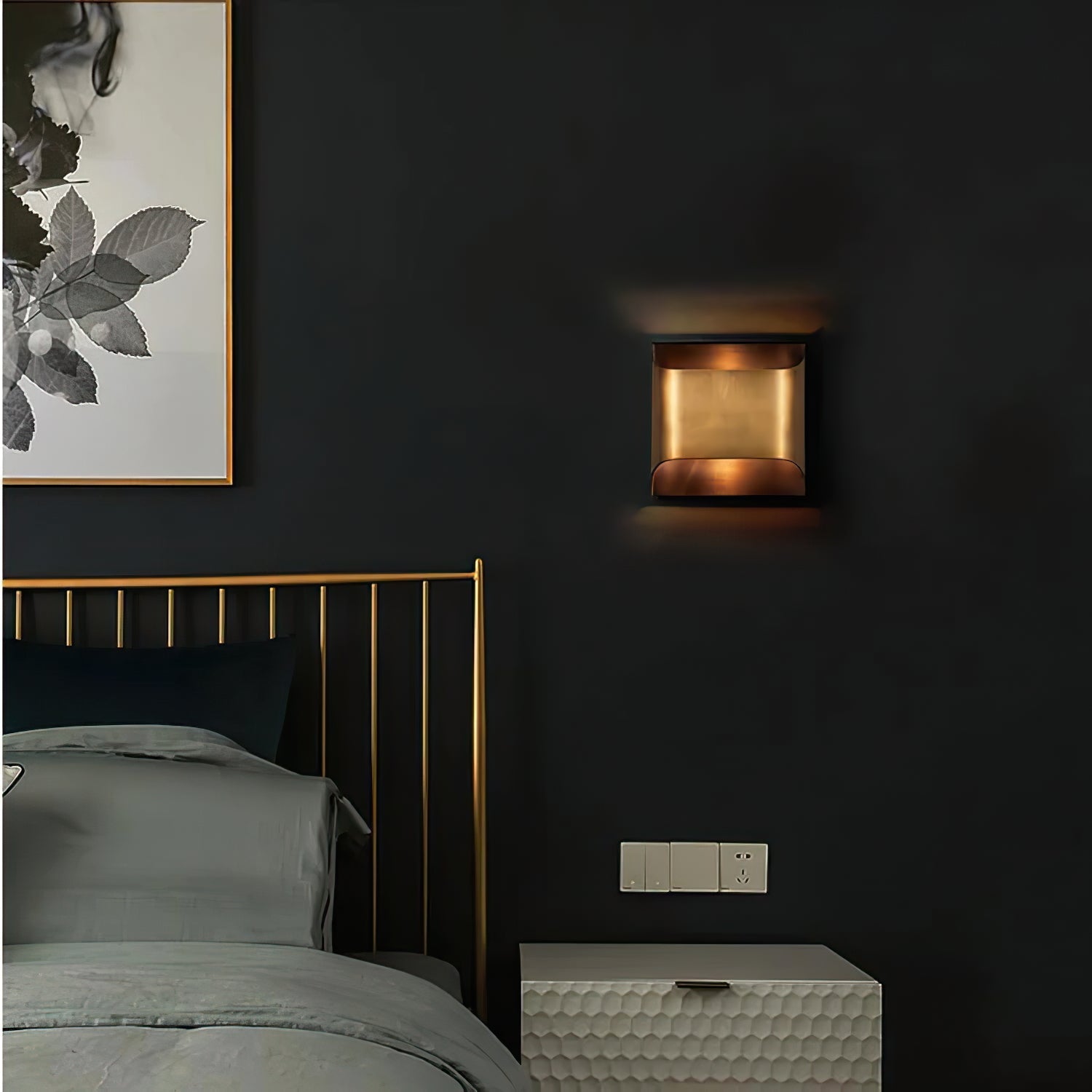 Solid brass wall sconce shown beside a bathroom mirror