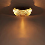 Curved disc ceiling light on a slender supporting rod