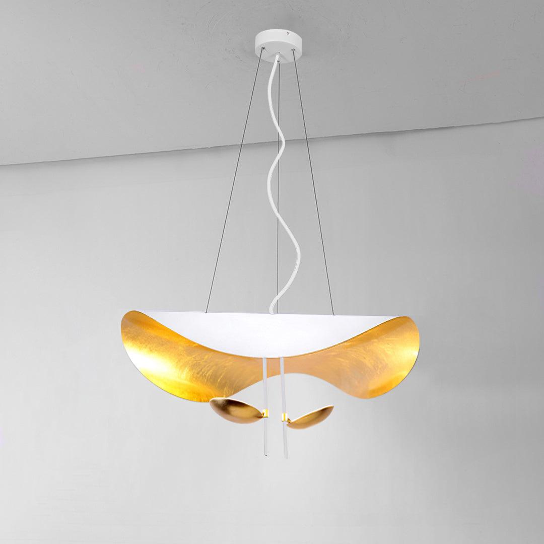 Curved disc pendant light shown against a pale wall