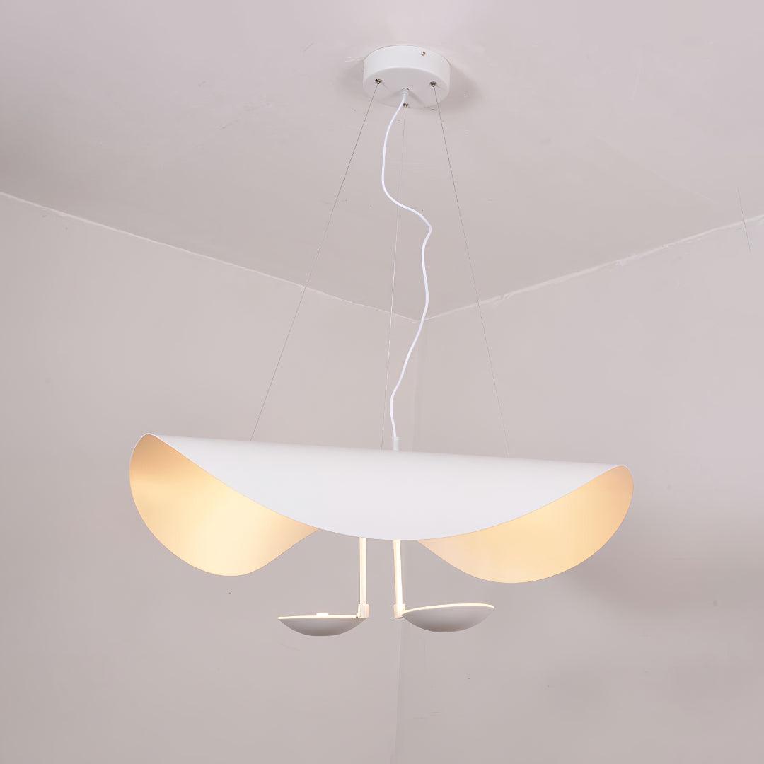 Black and gold disc pendant light with integrated LED glow