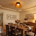 Layered glass ceiling light casting a calm even glow indoors