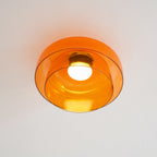 Layered glass-disc ceiling light with slim flush profile