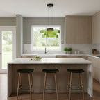 Tinted mouth-blown glass pendant light hanging in a dim room