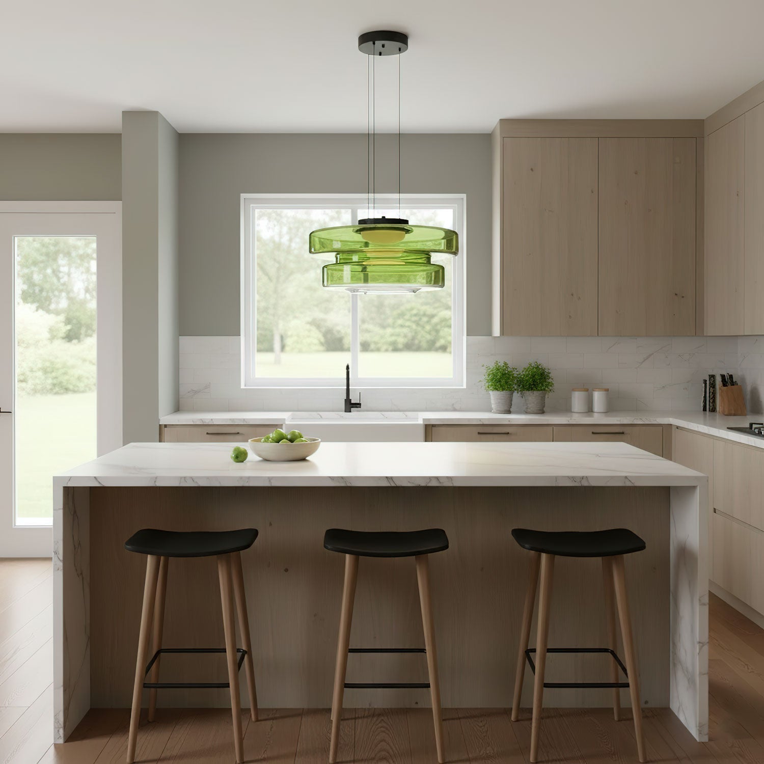 Tinted mouth-blown glass pendant light hanging in a dim room