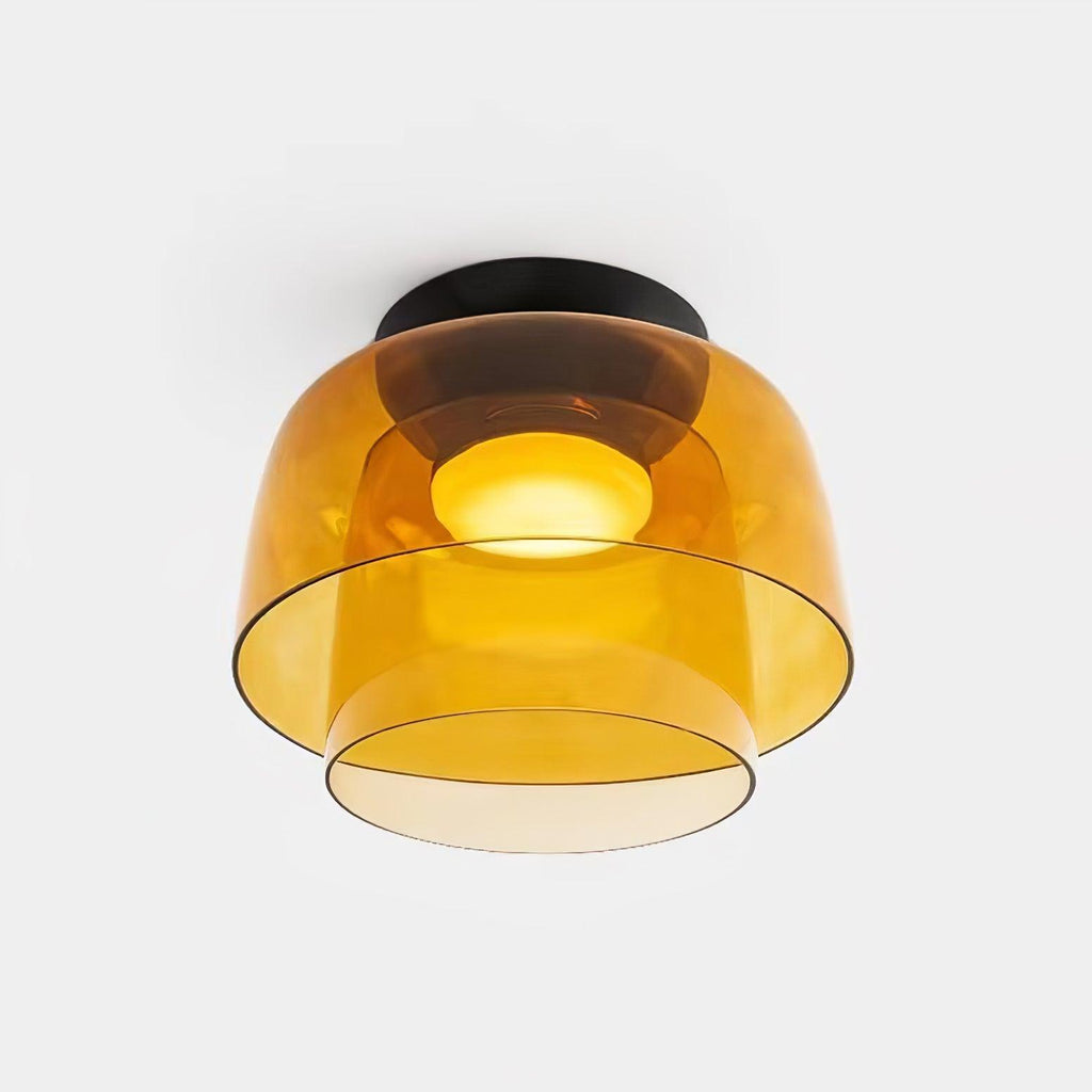 Stacked tinted glass ceiling light diffusing a calm even light