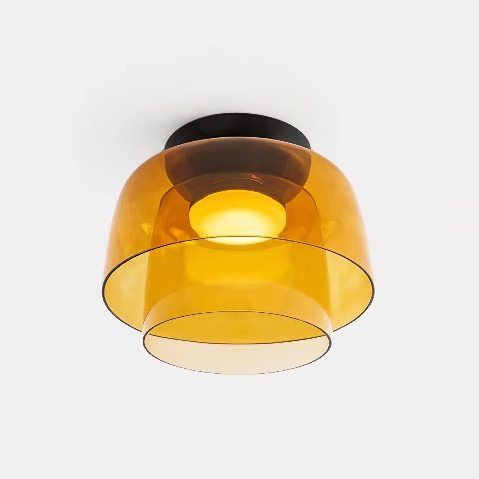 Stacked tinted glass ceiling light diffusing a calm even light