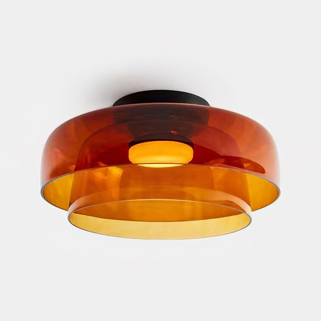Tinted glass ceiling light glowing gently above a hallway